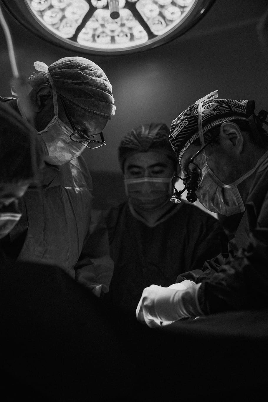 gray scale photo of three nurses and doctor about to surgery 910x1365 wallpaper teahub io gray scale photo of three nurses and