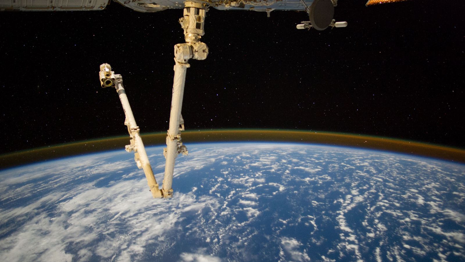 The Canadarm2 Attached To The International Space Station - Outer Space - HD Wallpaper 